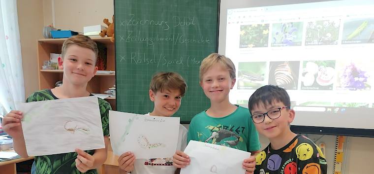 Die jungen Forscher:innen zeigten stolz, welche Entdeckungen sie am Trockenrasen gemacht haben. Hier: Zauneidechse.. © LPV/S. Girsch Schüler:innen mit gezeichneten Kunstwerken